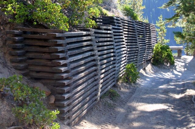 wood retaining wall outside house